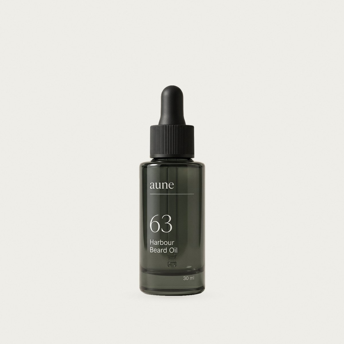 Harbour Beard Oil in a smoked glass oil bottle, on a warm white backdrop