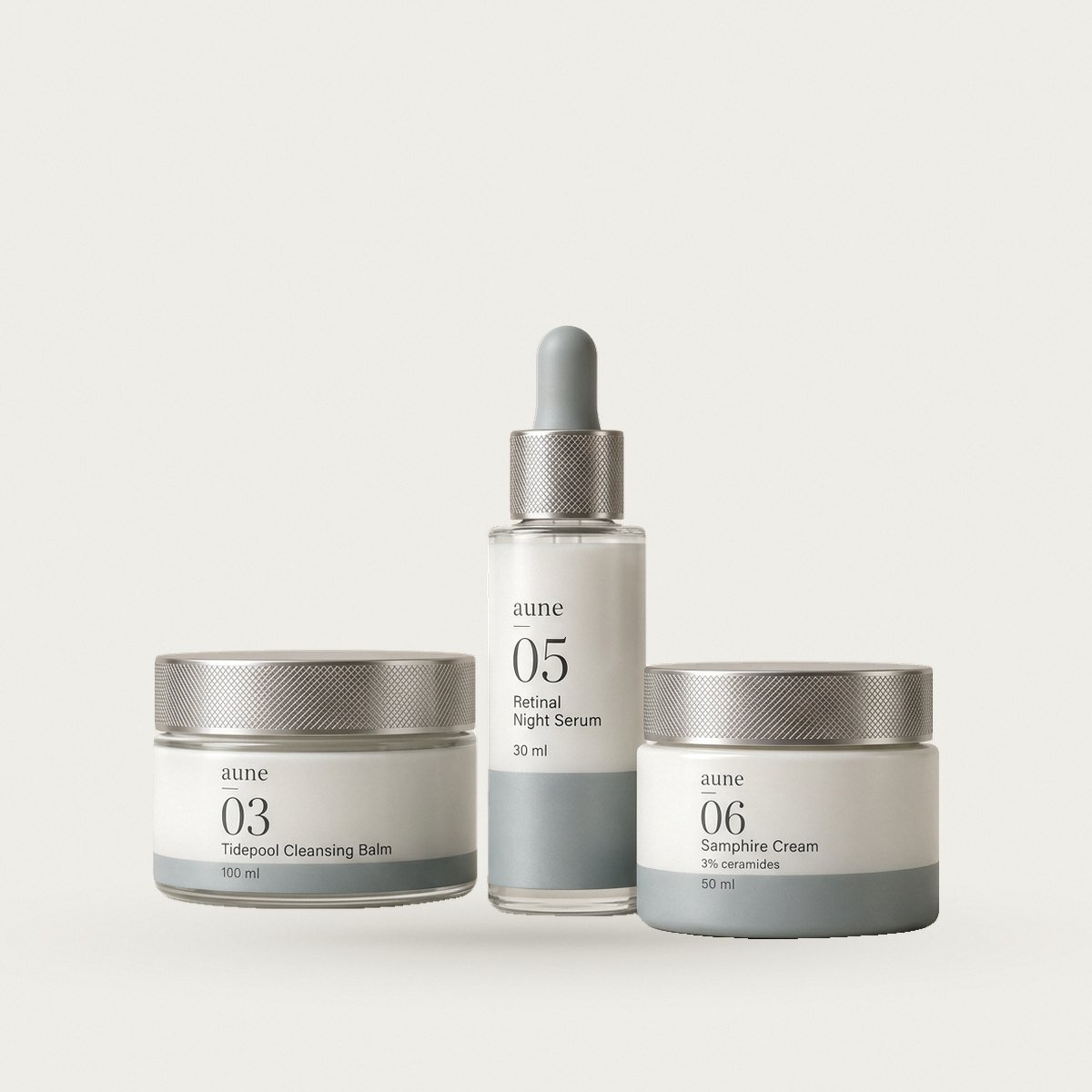 The Evening Three: the formulas grouped together on a warm white backdrop